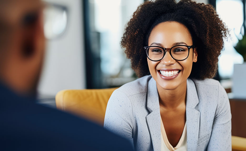 Woman smiles during a meeting