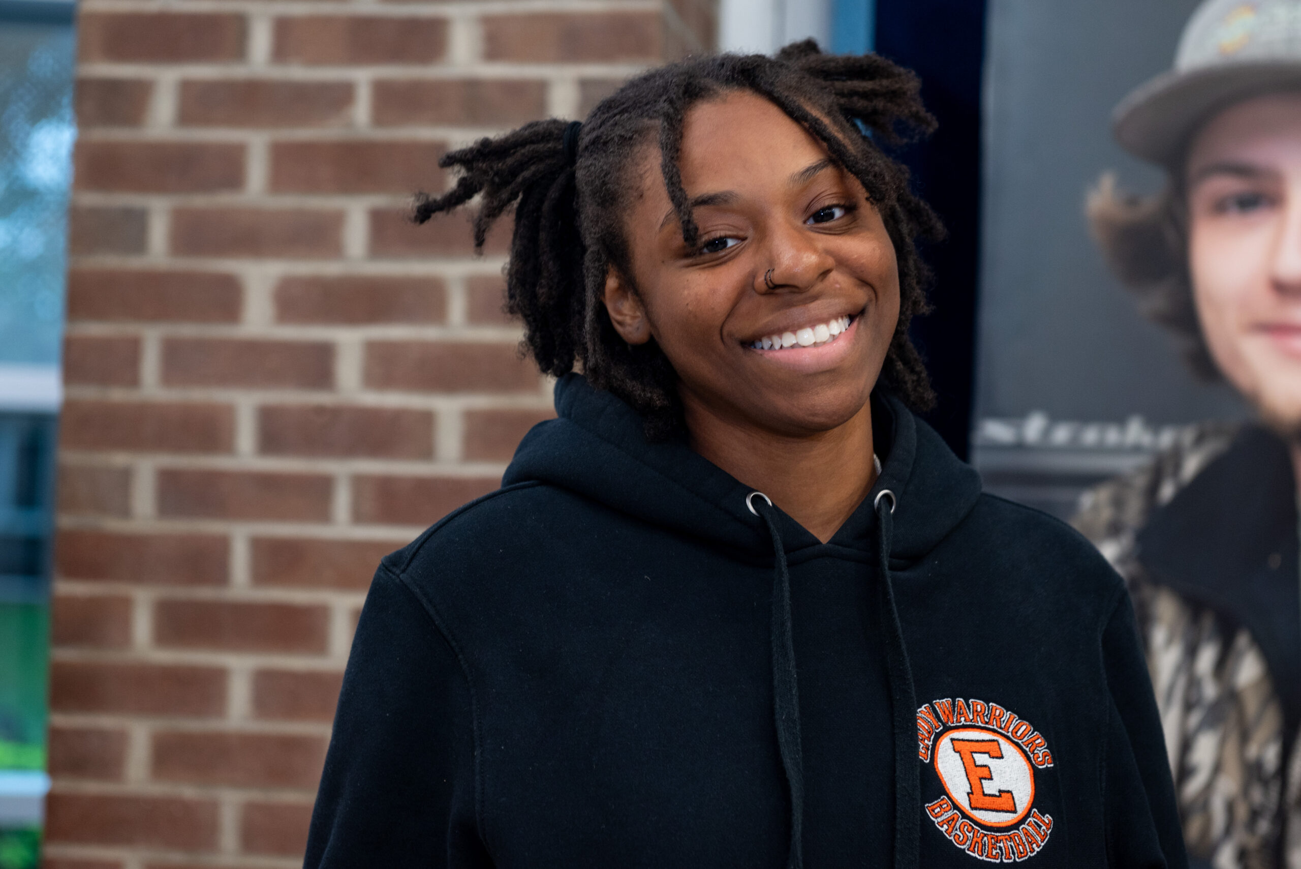 High school student smiles at camera while visiting Chesapeake College.