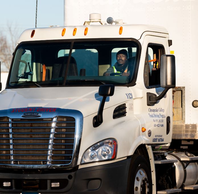 man driving tractor trailer