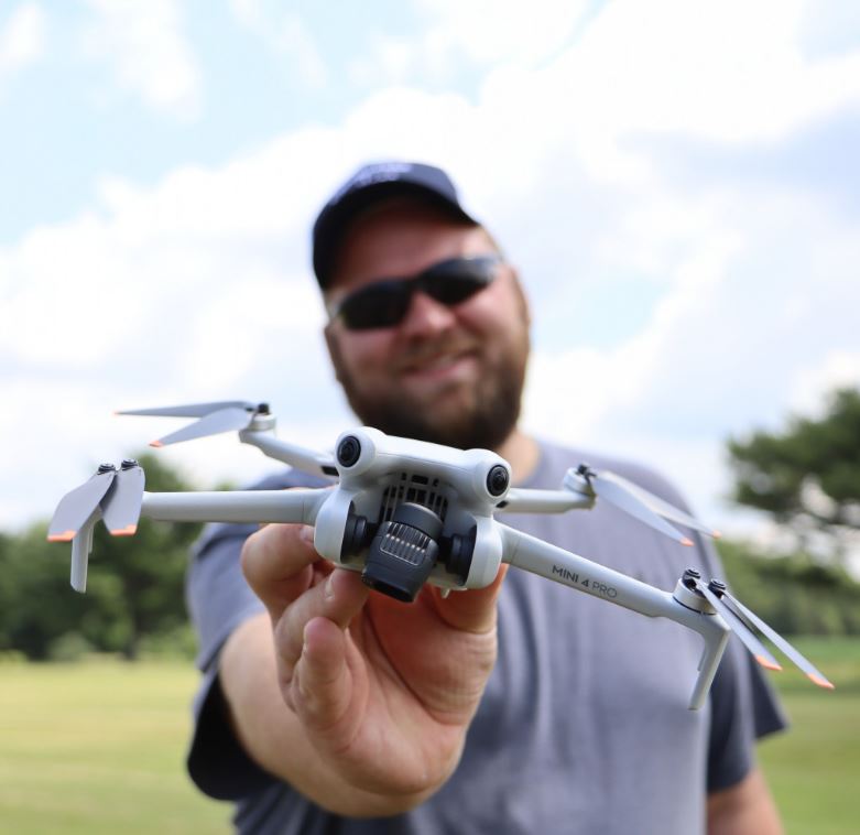 man holding drone