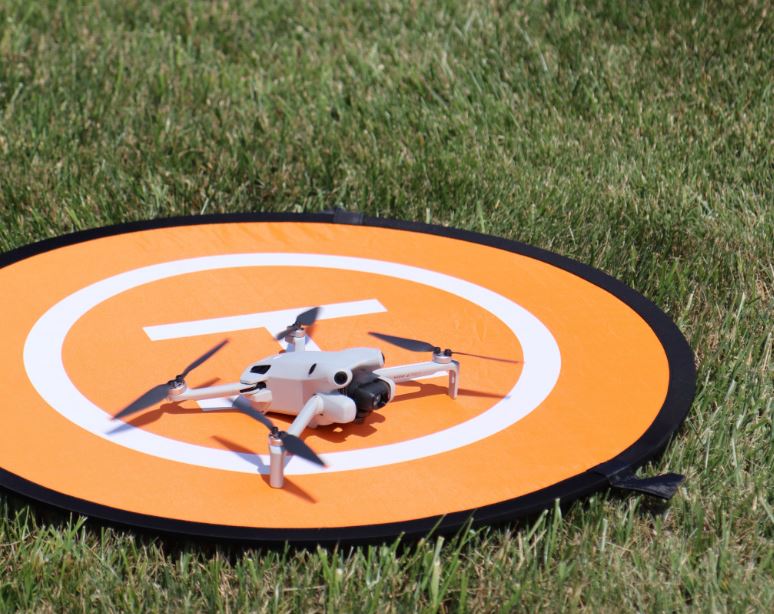 drone landing on target in grass